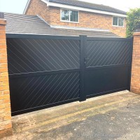 A pair of bespoke, aluminium gates fitted on a driveway at a home in Leyland, Lancashire.