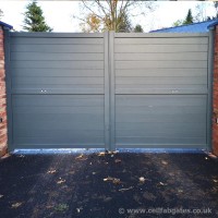 An installation of a bespoke aluminium gate finished with a grey powder coating at a property in Hoole Village, Chester.