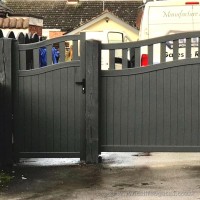 A matching pair of aluminium driveway and garden gates, with a curved top, installed at the front of a property in Chester.