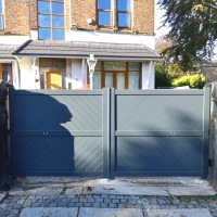 A full privacy, ready made, aluminium gate created in grey and installed at the front of a client’s home in Merseyside.