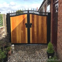 A bespoke timber infill, steel frame gate with black powder coating, fitted at a clients property in Wigan, Standish.