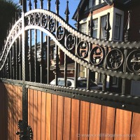 This bespoke timber infill gate was created with a steel frame and ornate ironwork and fitted at a home in Chorley.