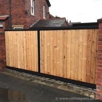 A bespoke sliding driveway gate created with a galvanised steel frame and timber infill, fitted at a property in Chorley.