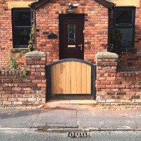 Recent installation in Preston of a bespoke timber infill garden gate with a grey powder coated steel frame.