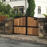 A black steel frame gate with timber infill and bespoke letter box, fitted at a client’s property in Cheshire.