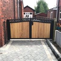An installation in Greater Manchester of a bespoke timber infill gate with a galvanised and powder coated steel frame.