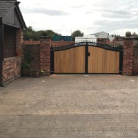 This bespoke timber infill gate with ornate ironwork was installed at a client’s property in Hindley, Wigan.