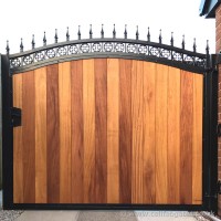 This bespoke timber infill, steel frame driveway gate was created with iroko hardwood and installed at a Chorley property.