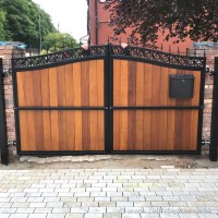 This installation of a steel and timber garden gate was fitted with matching panels at a property near Bolton.