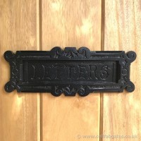 A bespoke wrought iron letter box, installed on our timber infill driveway gates.