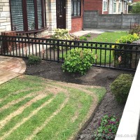 An installation in Chorley, Lancashire of bespoke garden railings in a hammered steel effect.