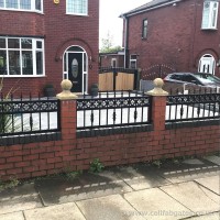 A set of bespoke, iron wall railings, which were created and installed at a home in Worsley, Manchester.