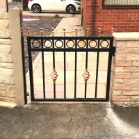 A small, wrought iron garden gate installation at a client’s home near Preston.